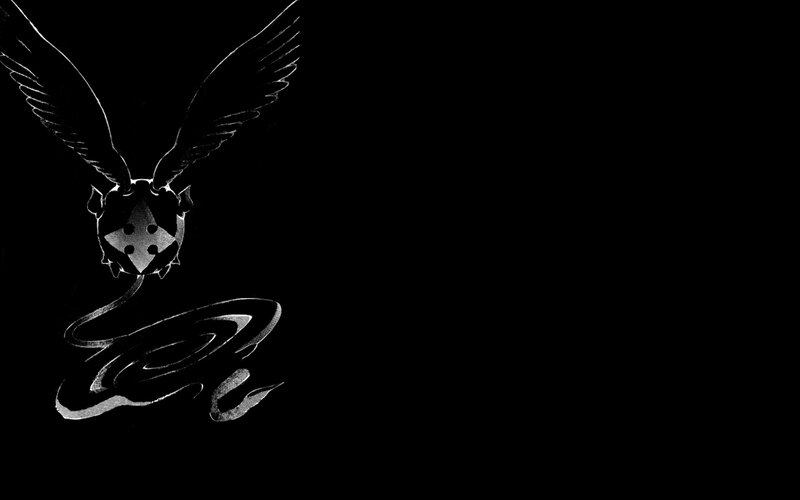 winged emblem with stylized text