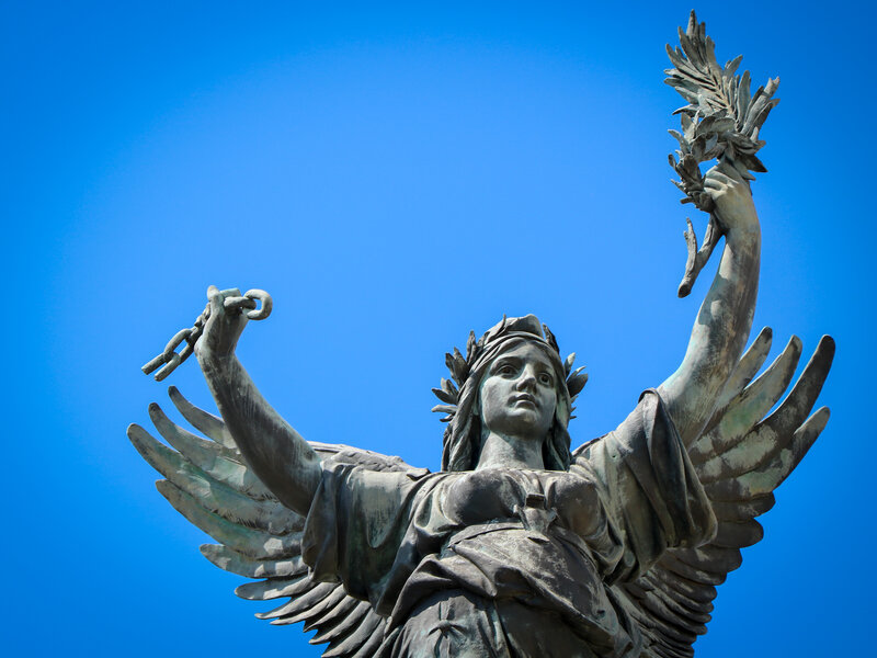 Winged Statue Holding Chains