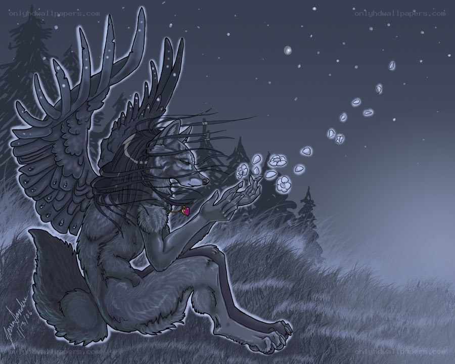 winged wolf in snowy forest