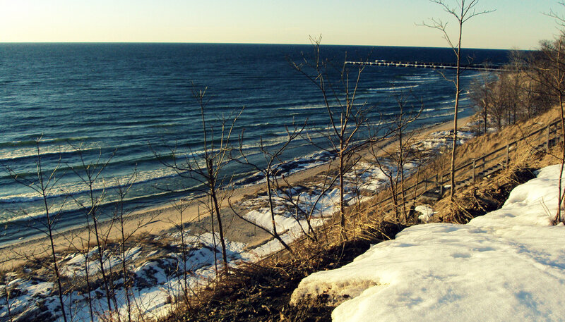 Winter beach with snow and ocean
