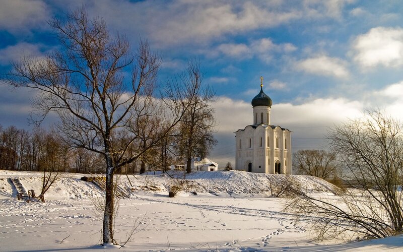 Winter church on a snowy hill