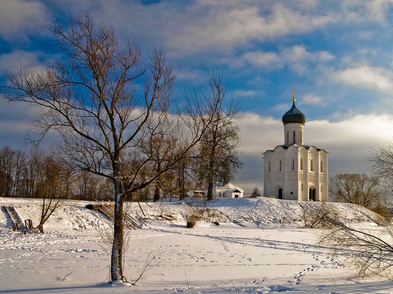 Winter church on a snowy hill