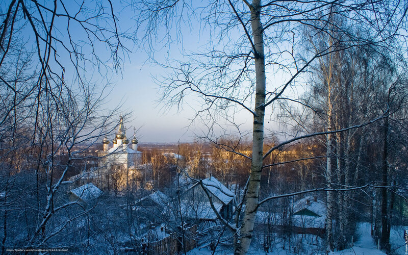 Winter church view through trees