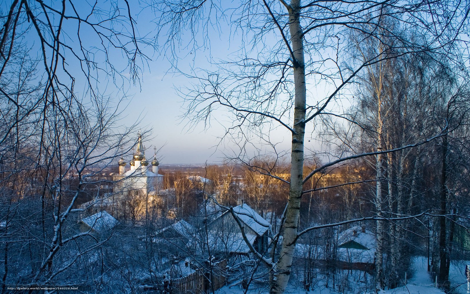 Winter church view through trees