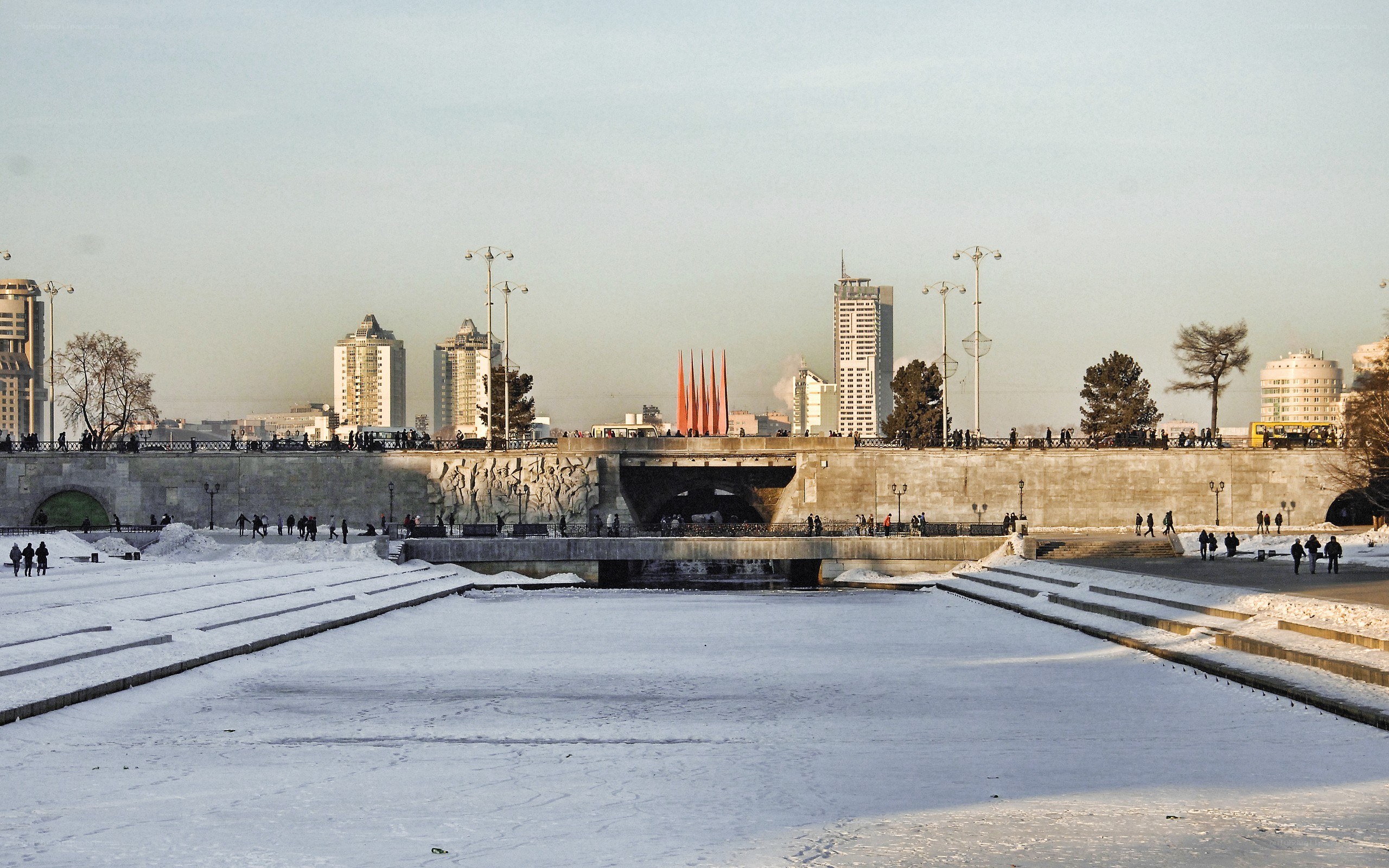 Winter cityscape with frozen river