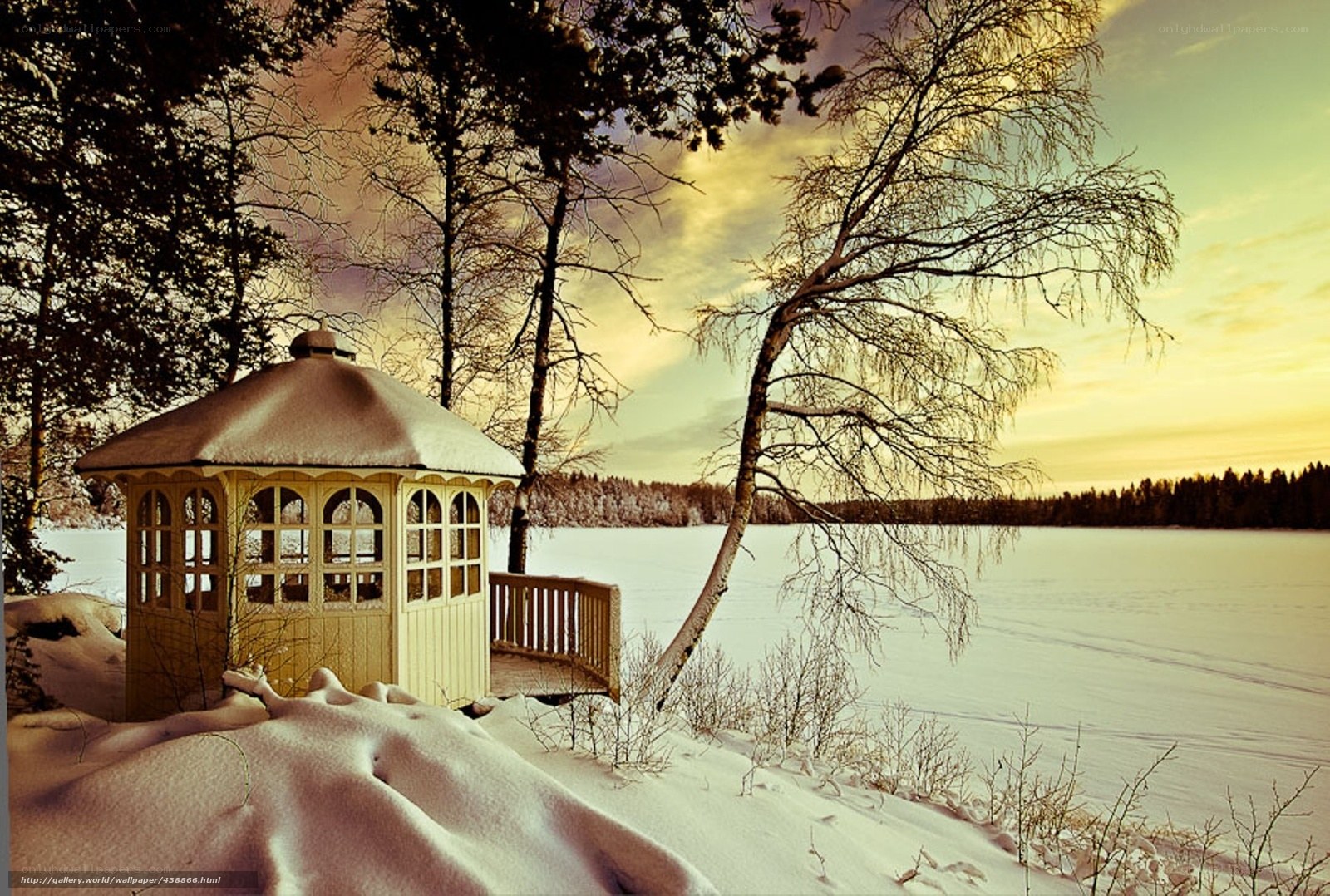 Winter gazebo by frozen lake