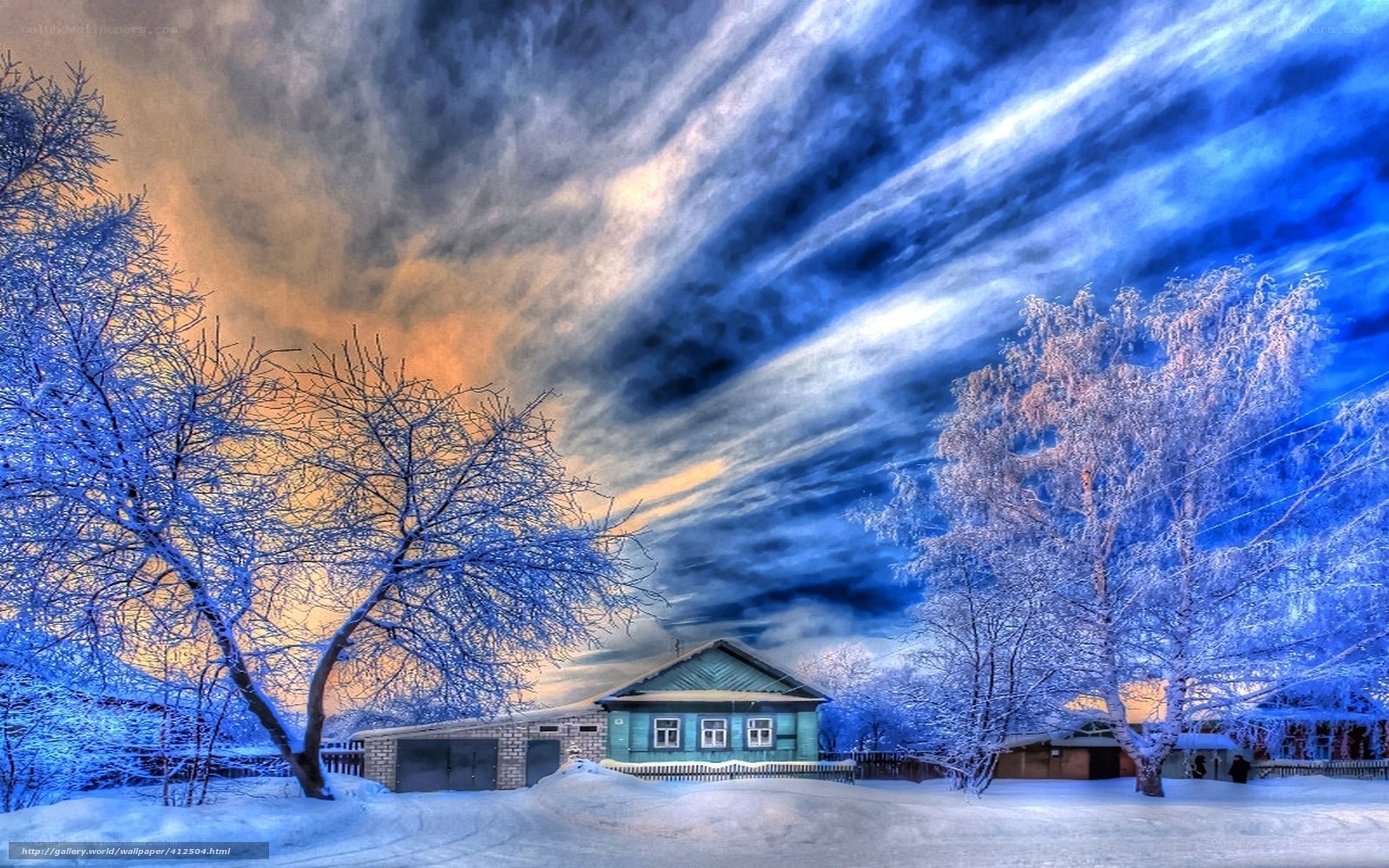 Winter house under dramatic sky