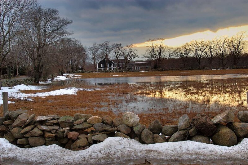 Winter landscape with farmhouse
