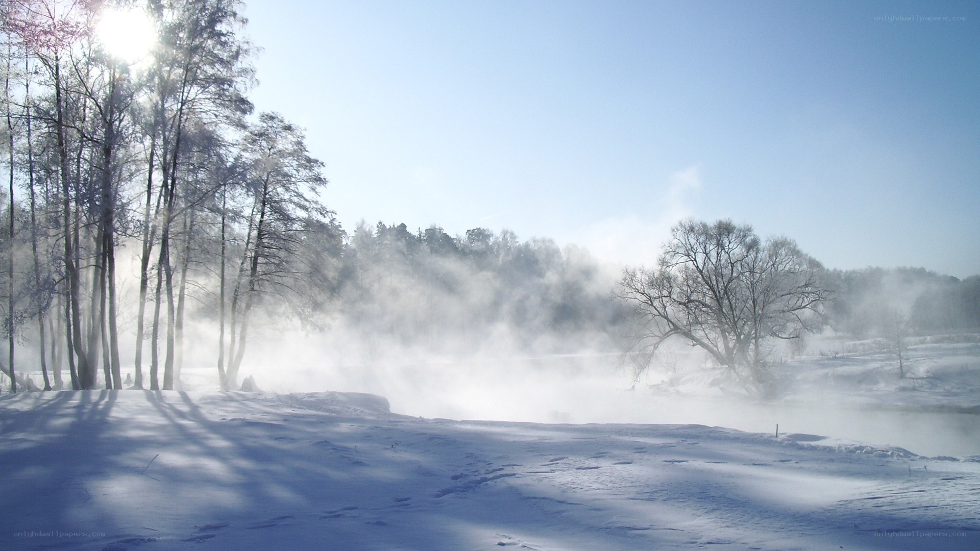 Winter mist over a snowy river