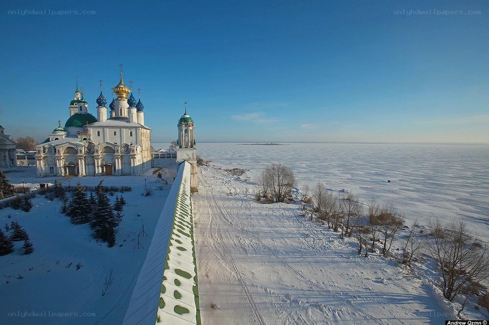 Winter monastery by frozen lake