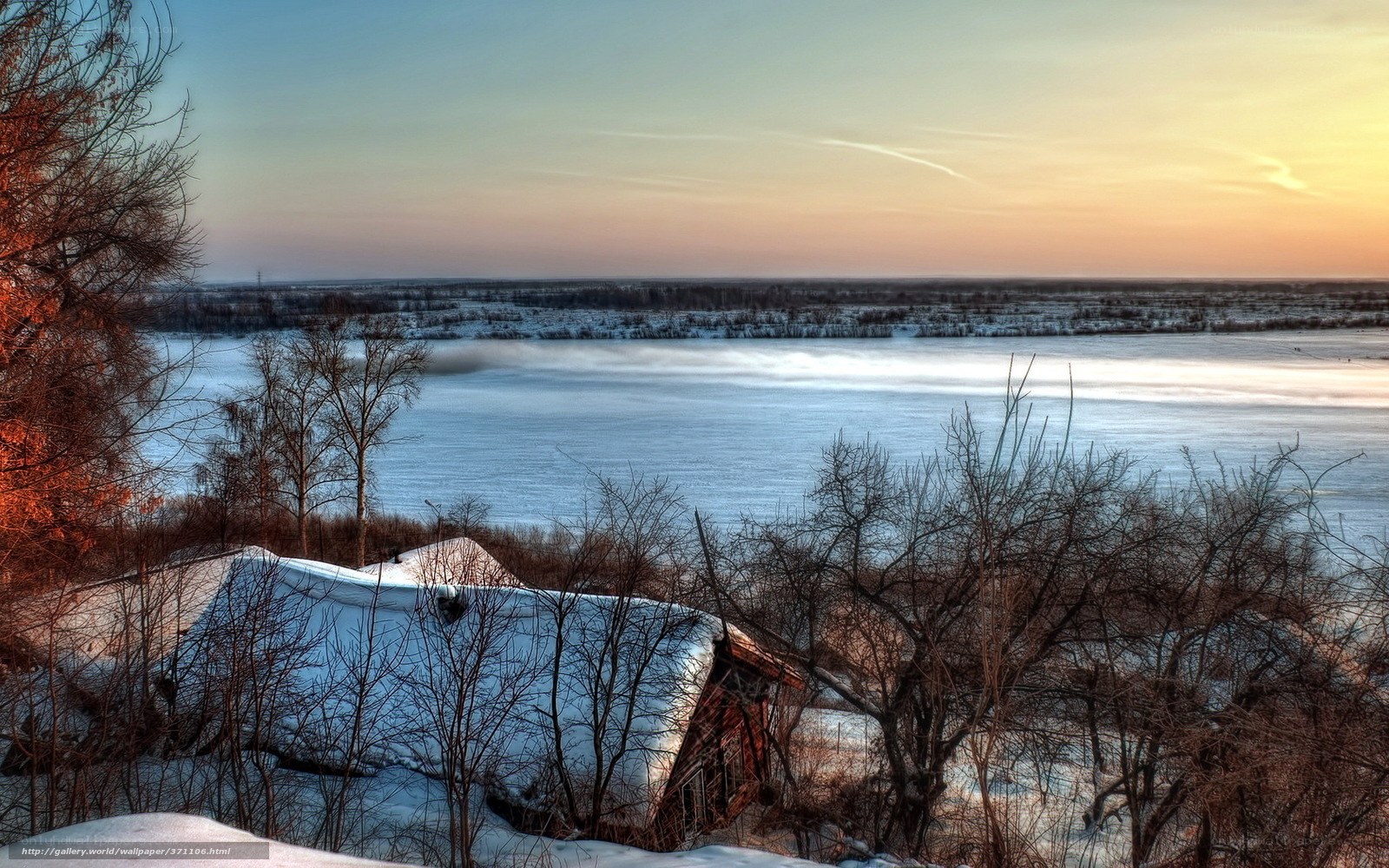Winter river landscape at sunset