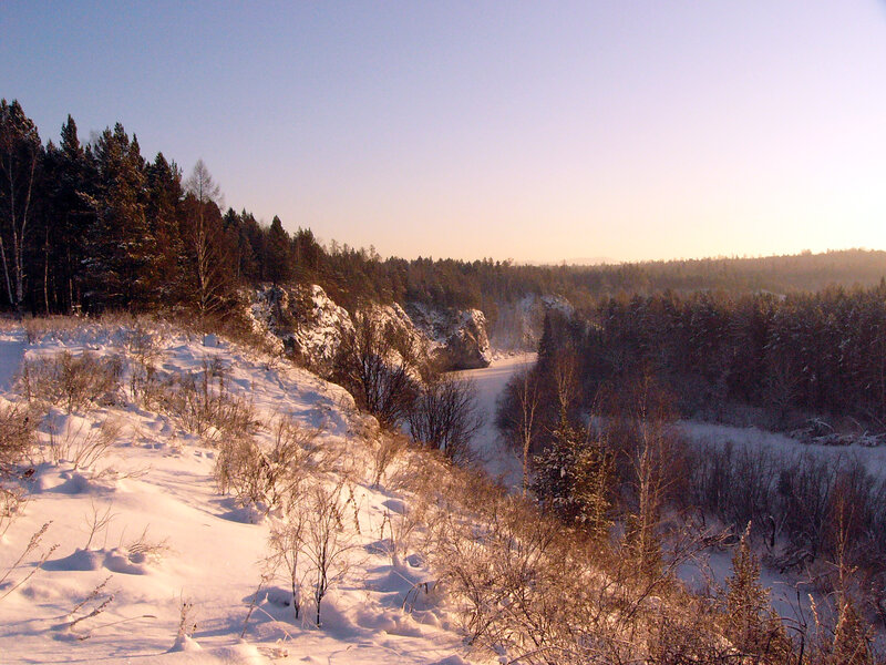 Winter river valley at sunset
