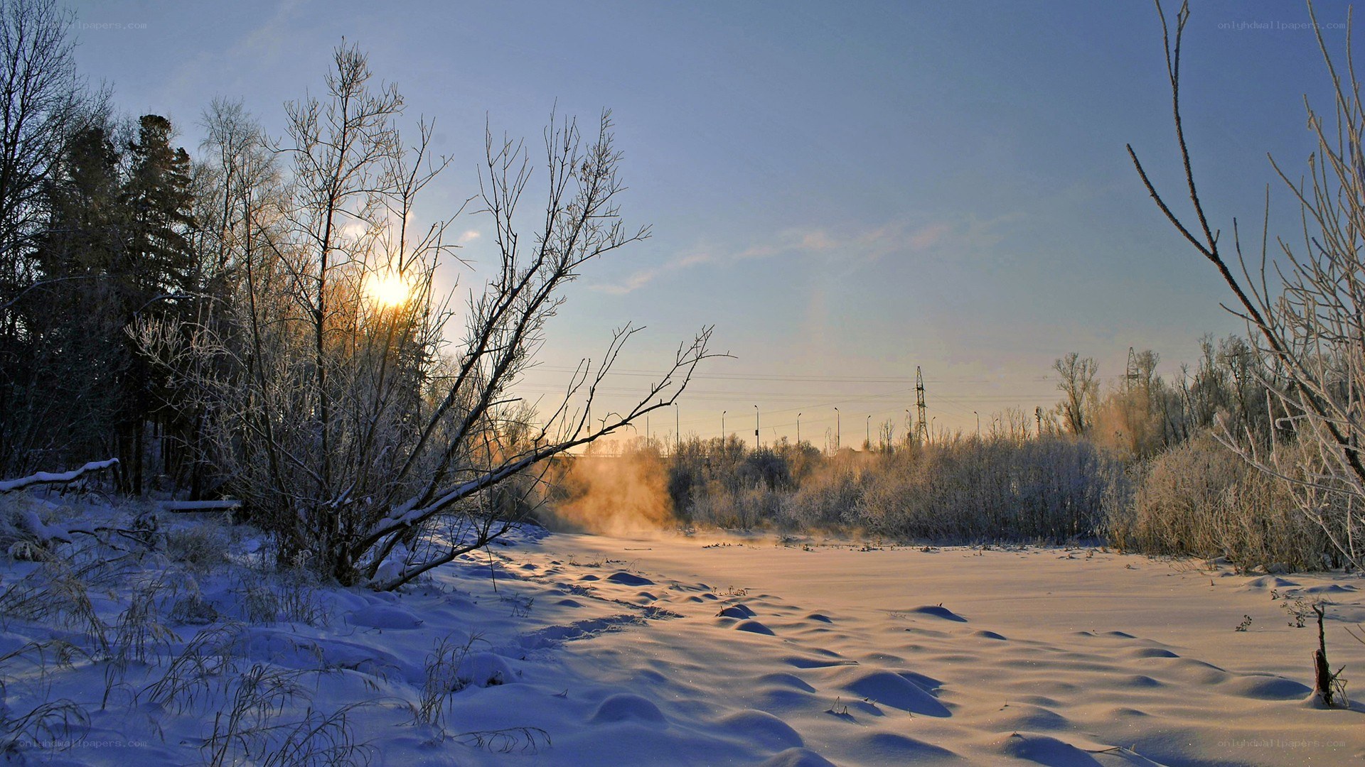 Winter sunrise over snowy landscape