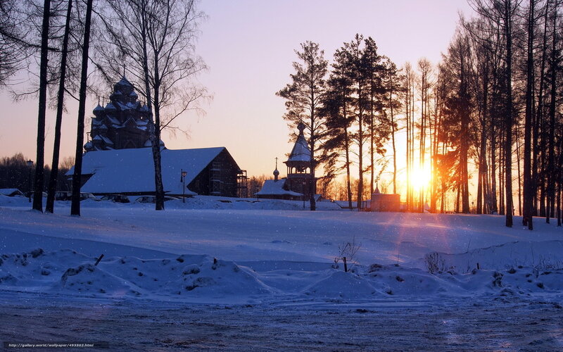 Winter sunset at a wooden church