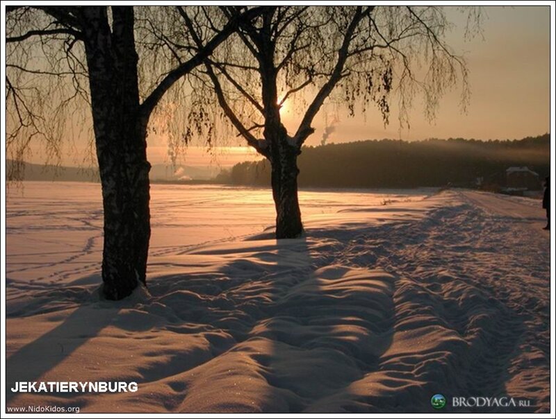 Winter sunset by a frozen lake
