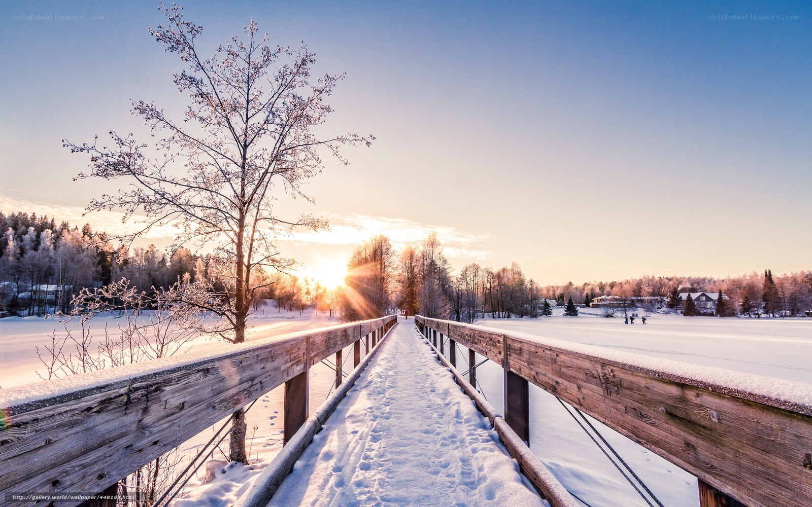 Winter sunset on a snowy bridge