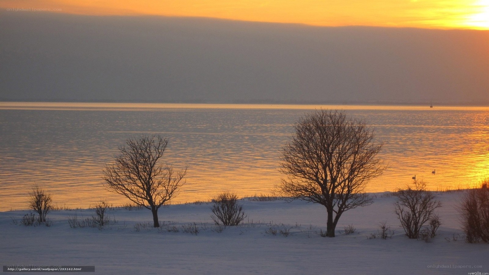 Winter sunset over a frozen lake