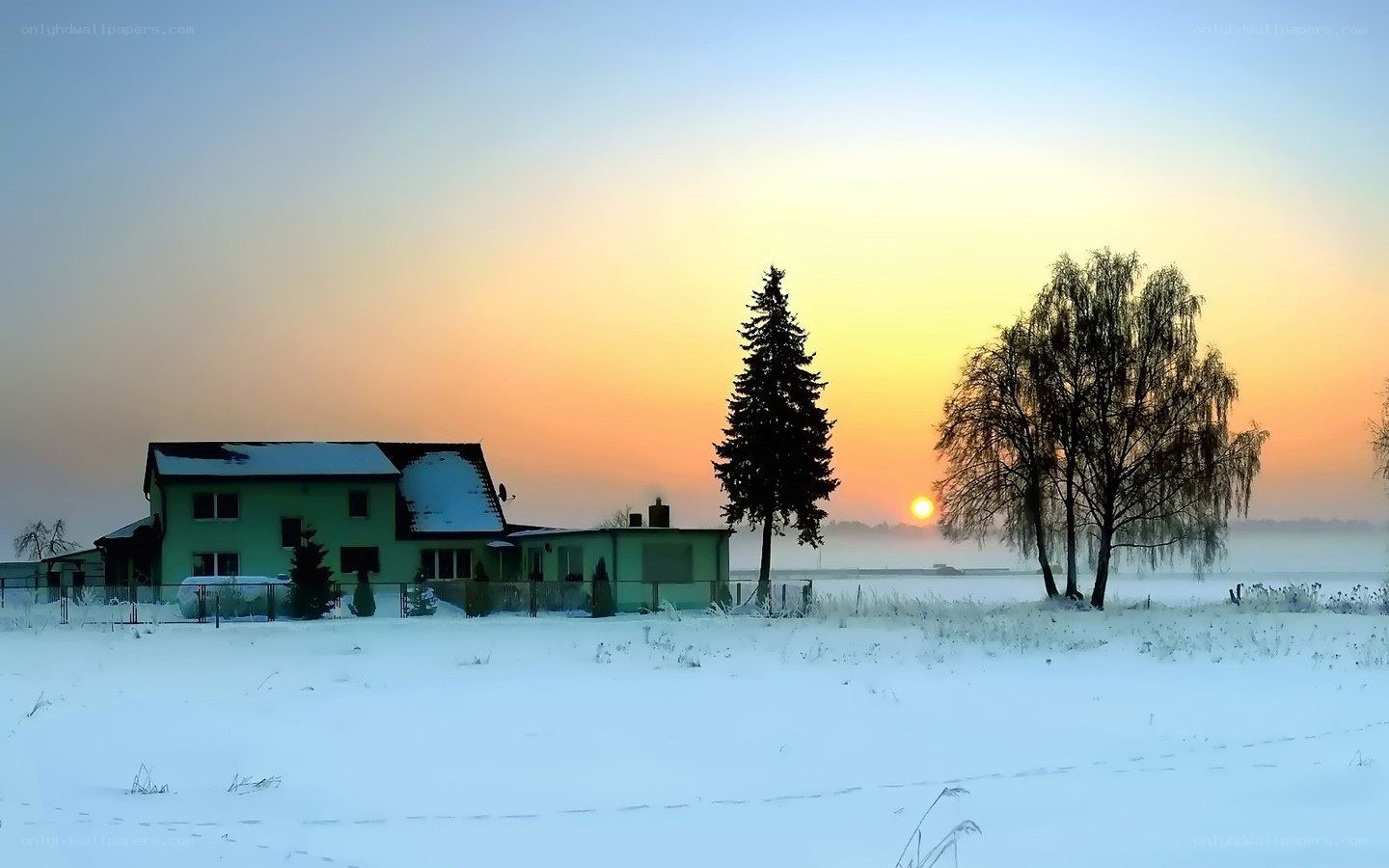 Winter sunset over a house