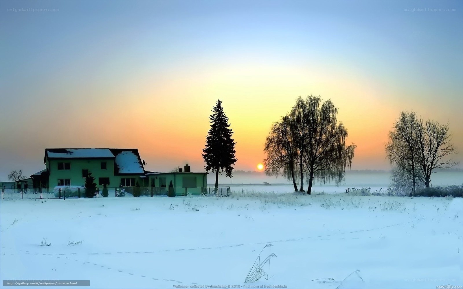 Winter sunset over a snowy house