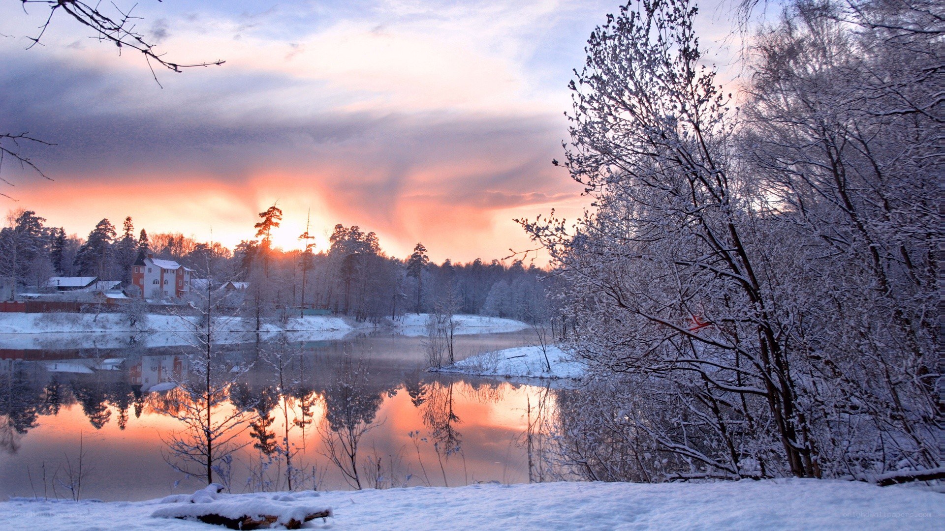 Winter sunset over a snowy river