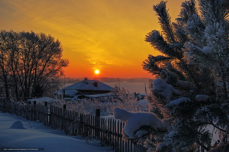 Winter sunset over a snowy village