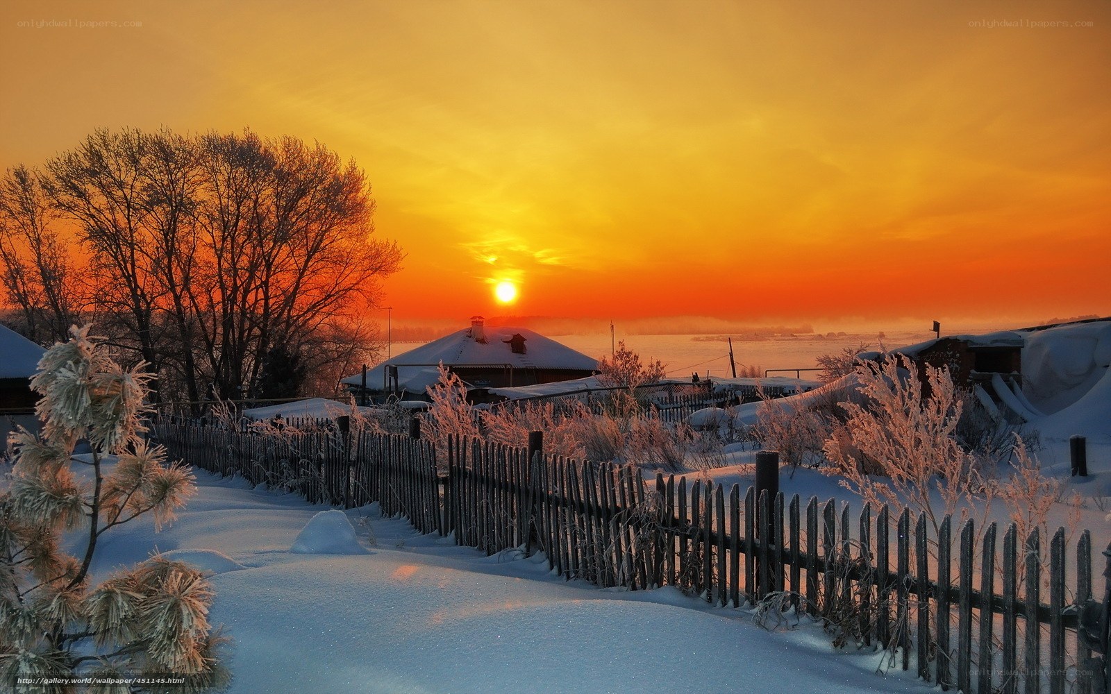 Winter sunset over a snowy village