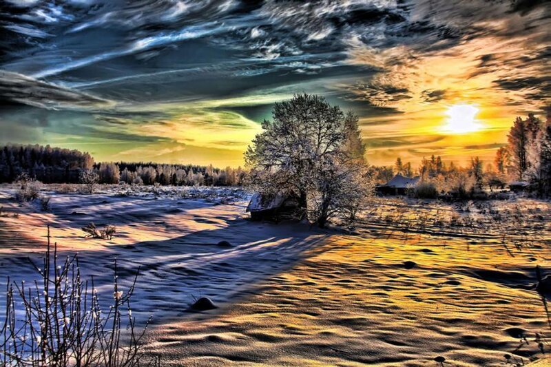 Winter sunset over snowy landscape