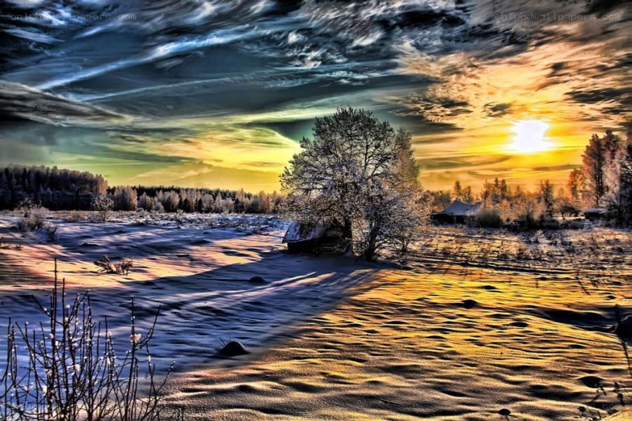 Winter sunset over snowy landscape