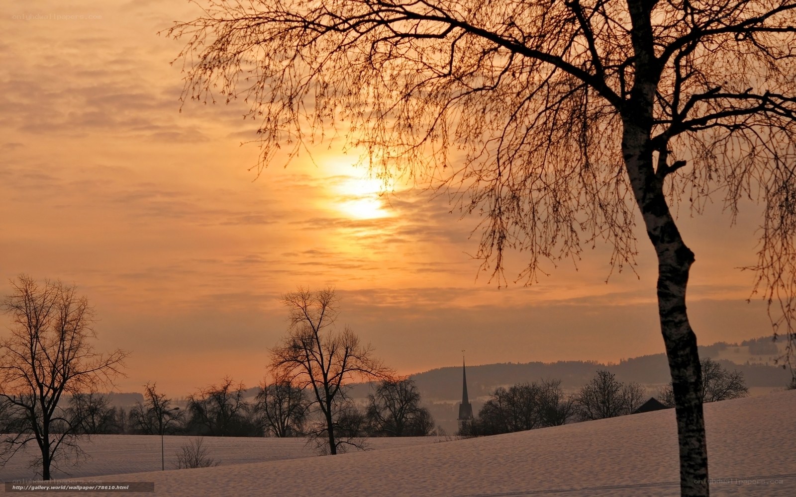 Winter sunset over snowy landscape