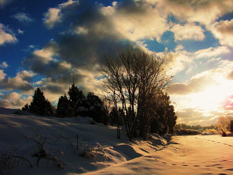 Winter sunset with snow and clouds