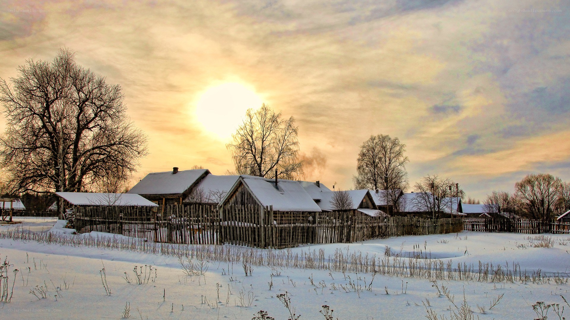 Winter village at sunset