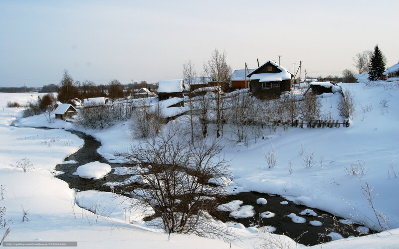 Winter village by a stream