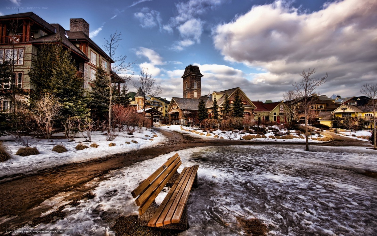 Winter village scene with bench