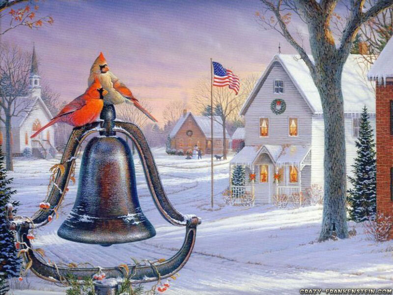 Winter village with cardinals on bell