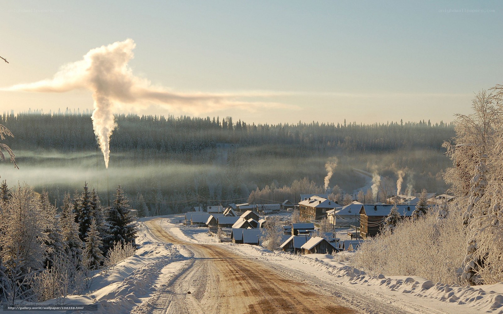 Winter village with smoke