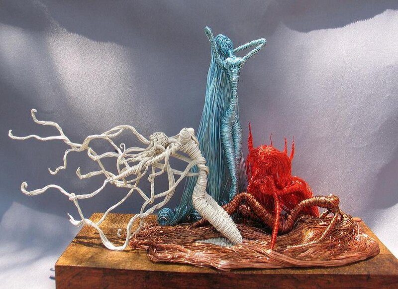 Wire sculpture of three figures