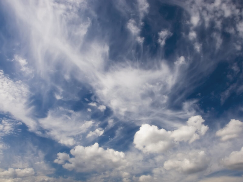 wispy clouds in blue sky