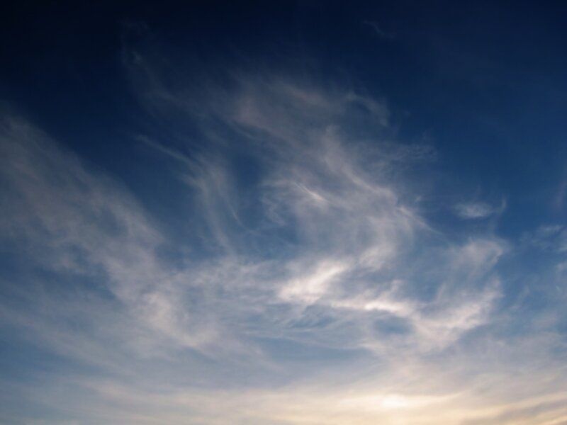 Wispy Clouds in Blue Sky — Serene, Sunset, Photograph