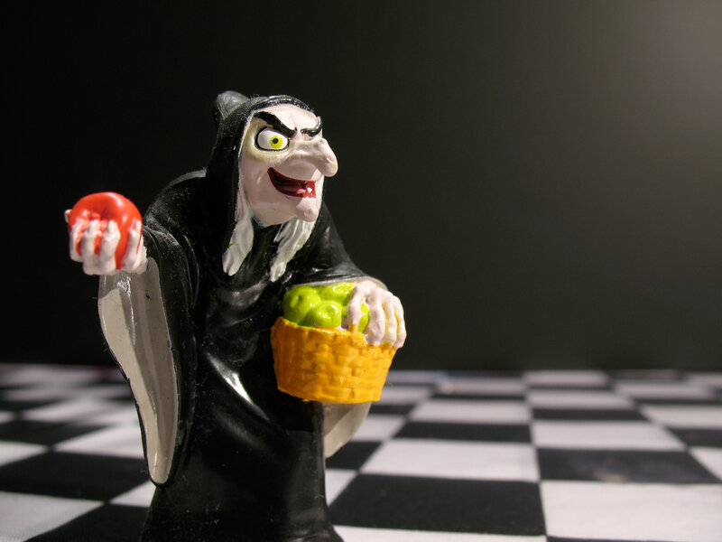 Witch figurine with apple
