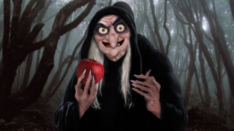 Witch holding a red apple