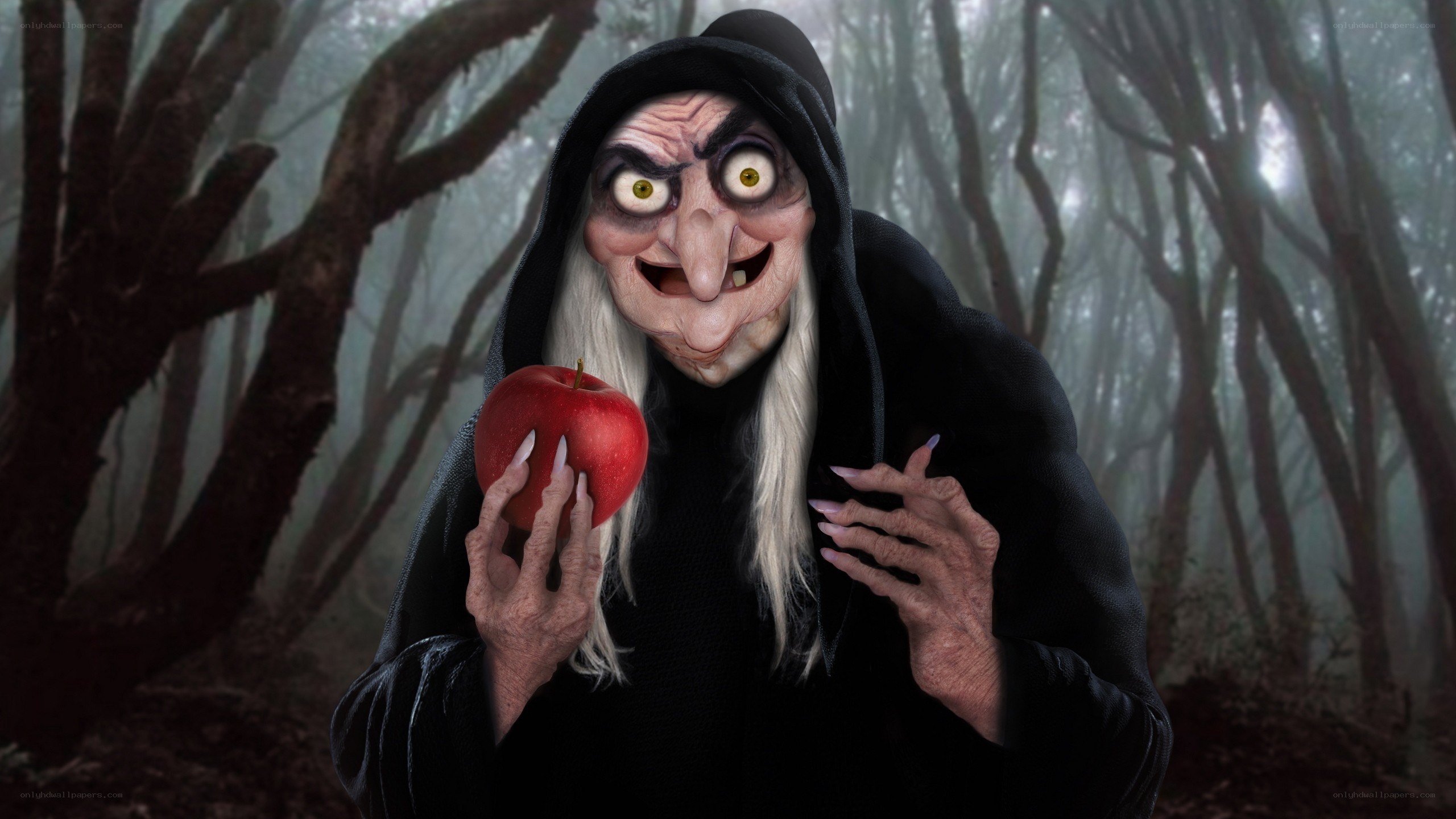 Witch holding a red apple