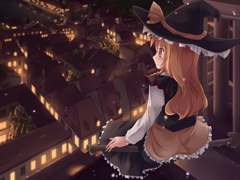 witch on a broom at night