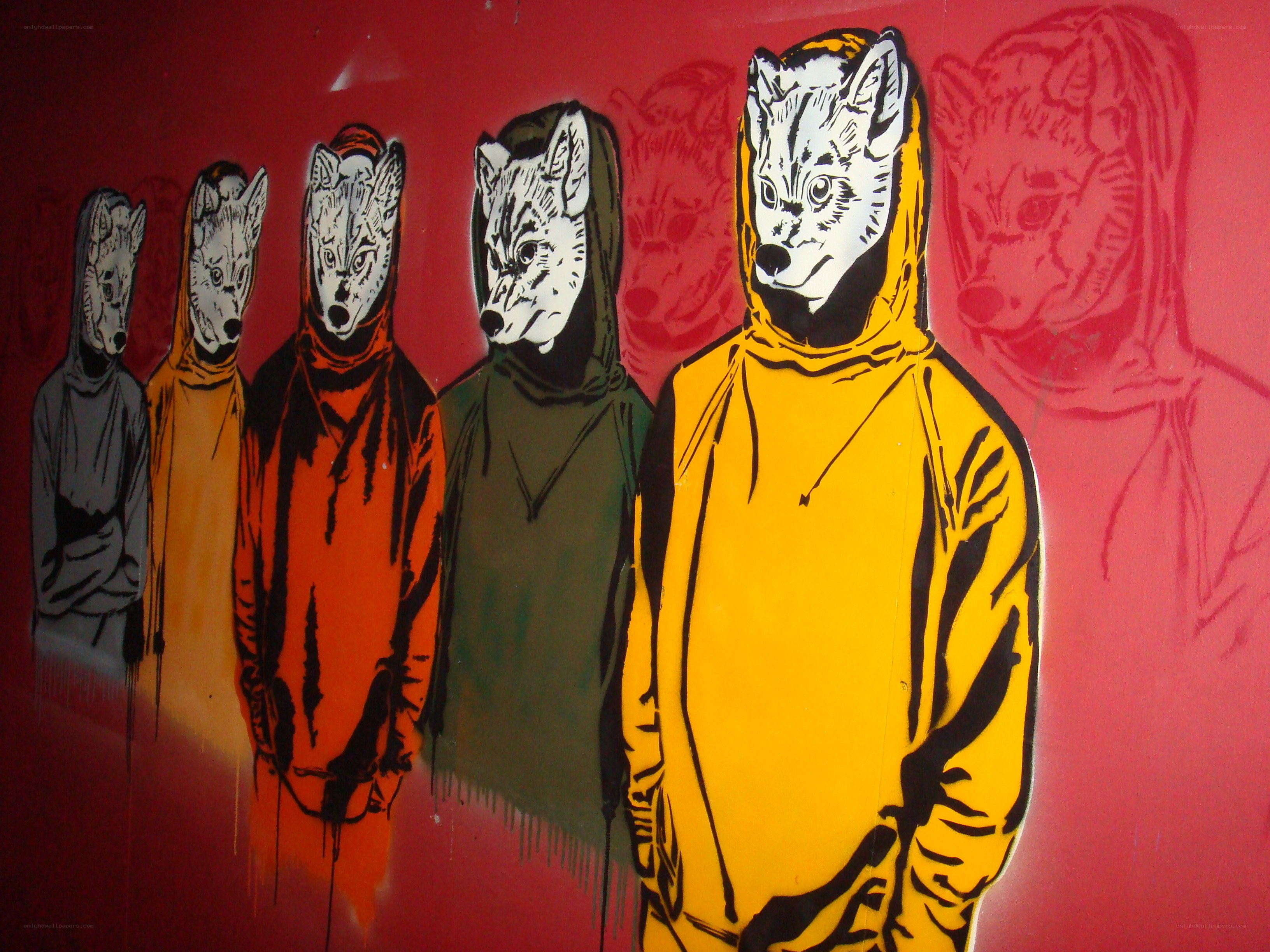 wolf-masked figures in graffiti