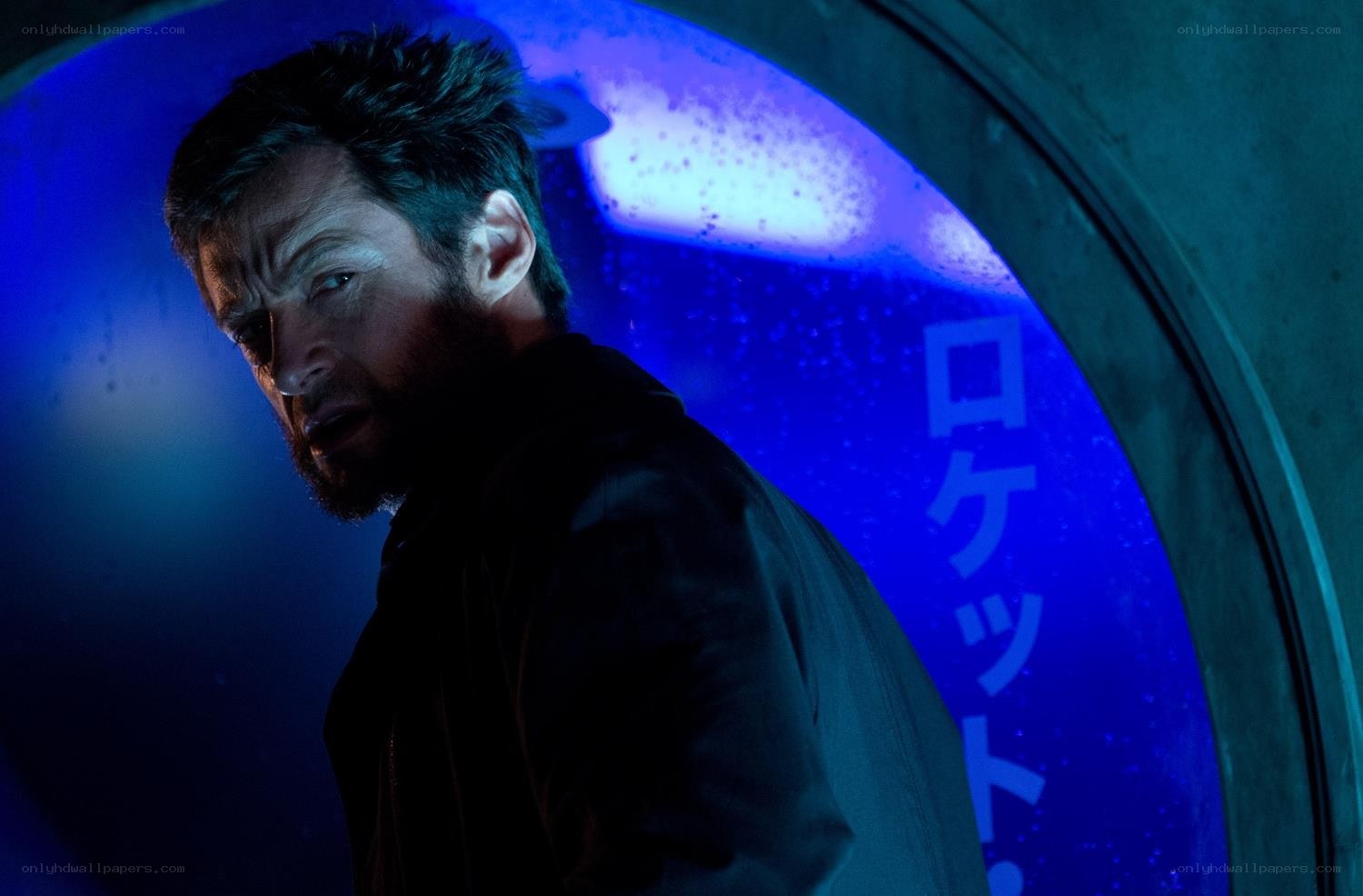 Wolverine in a blue-lit corridor
