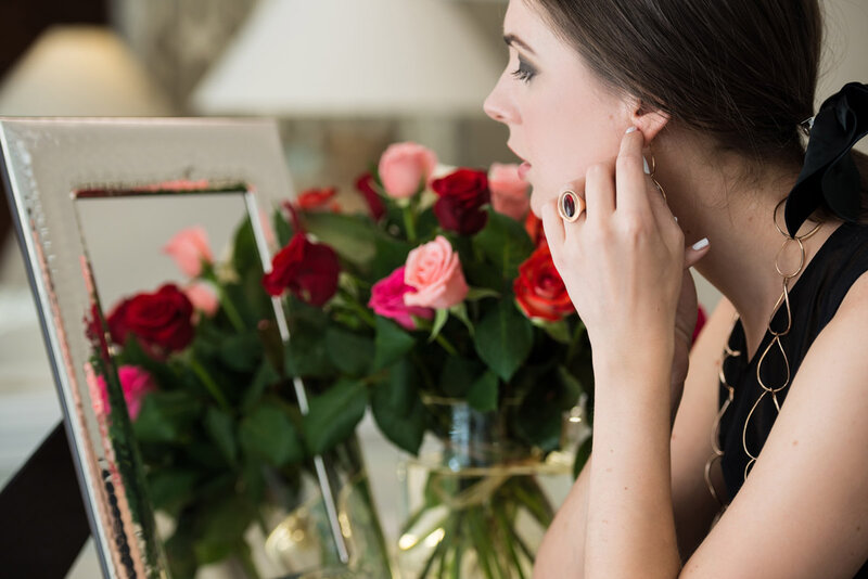 Woman Adjusting Earring — Black