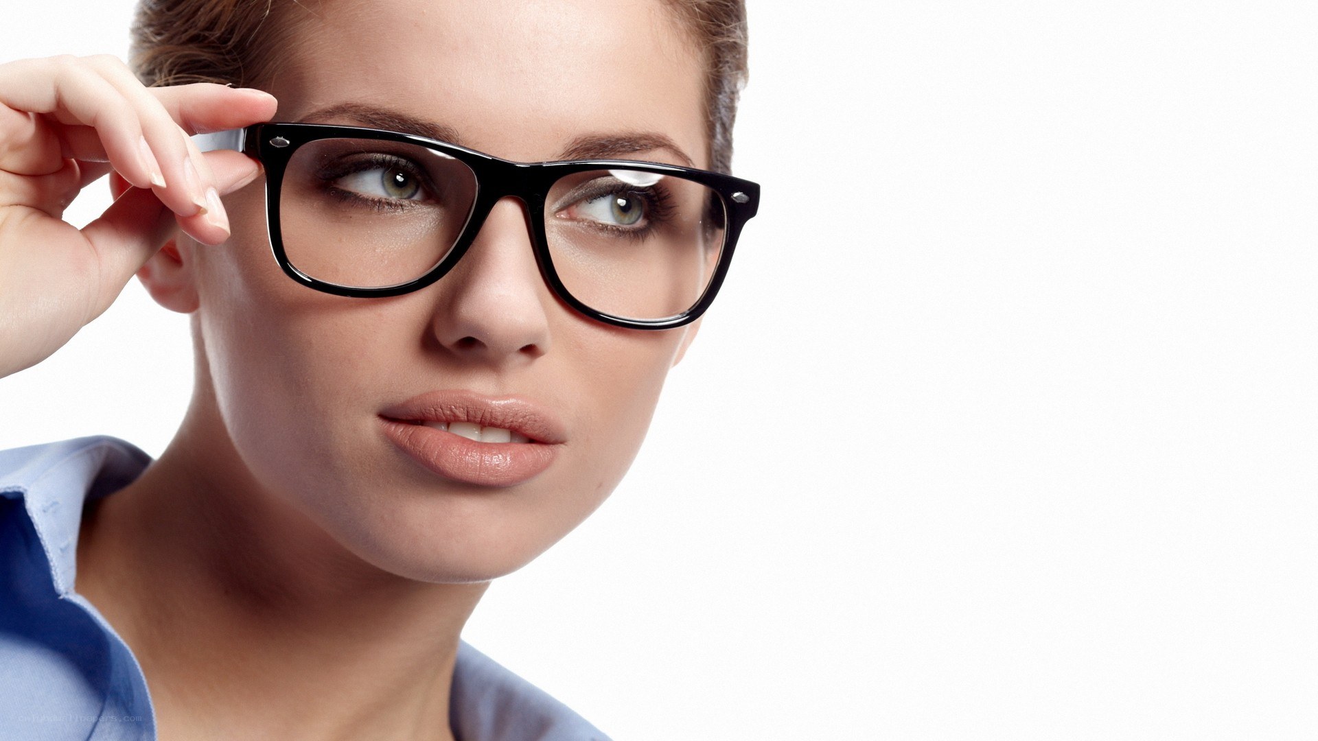 woman adjusting glasses