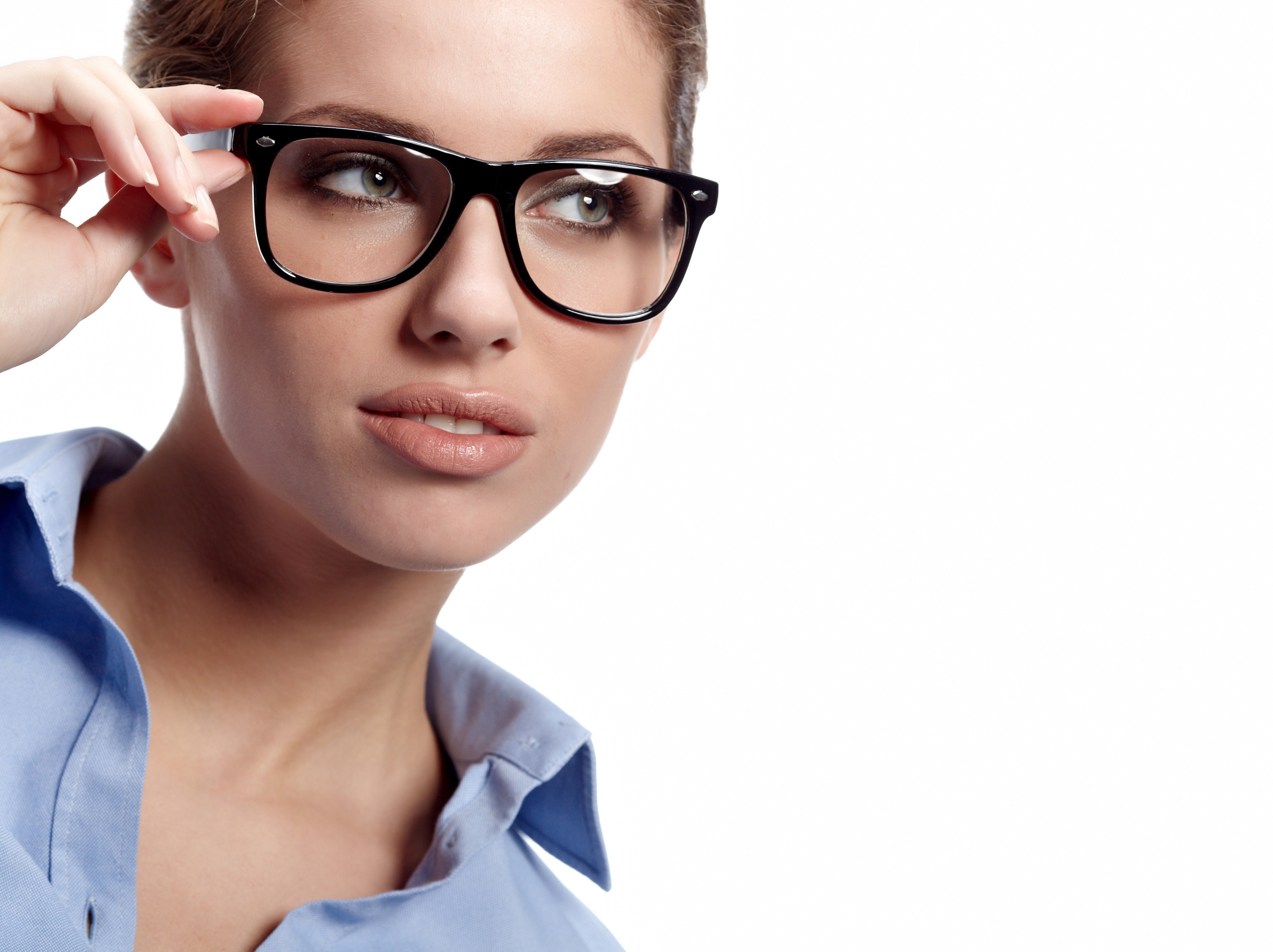 woman adjusting glasses