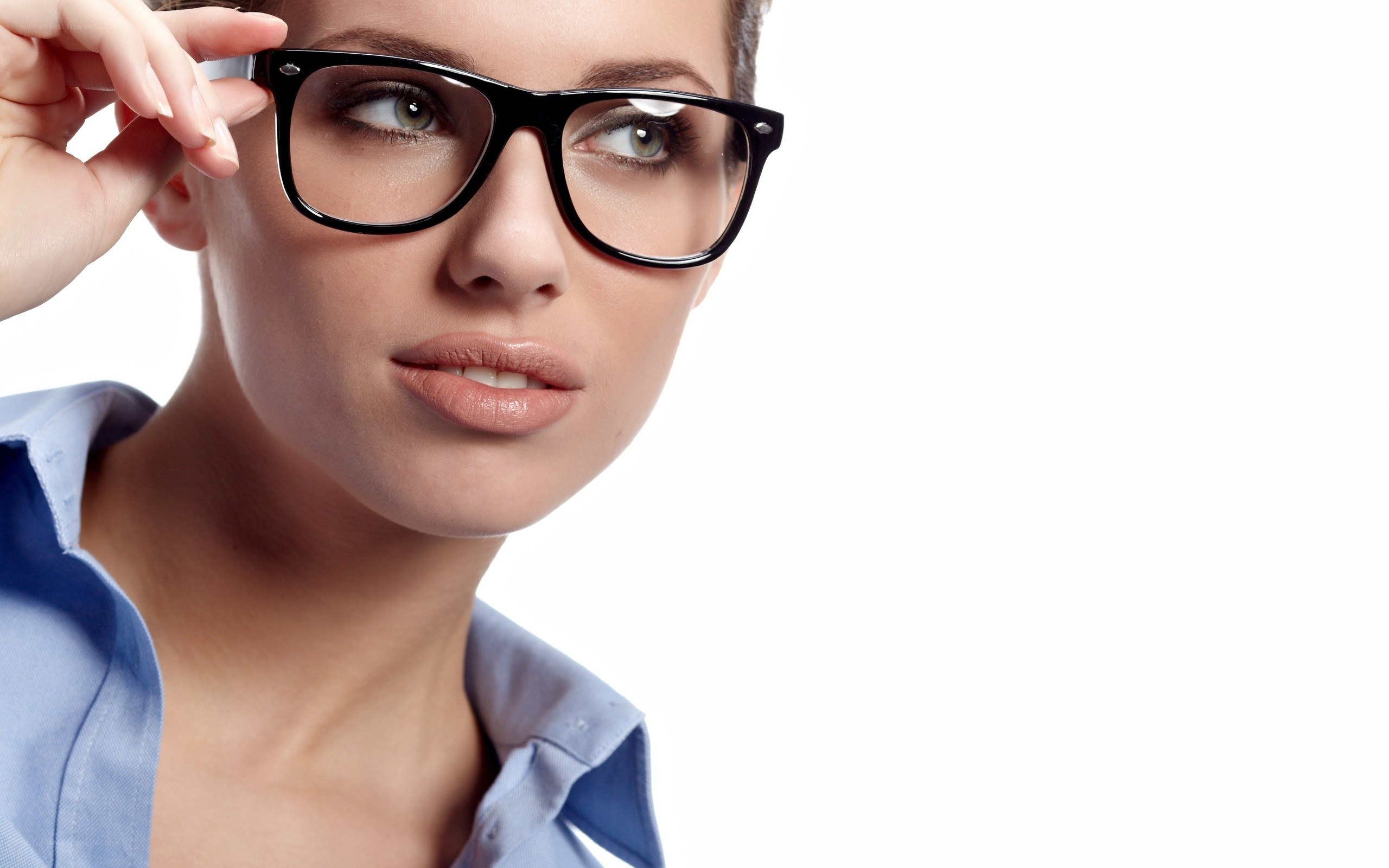 woman adjusting glasses