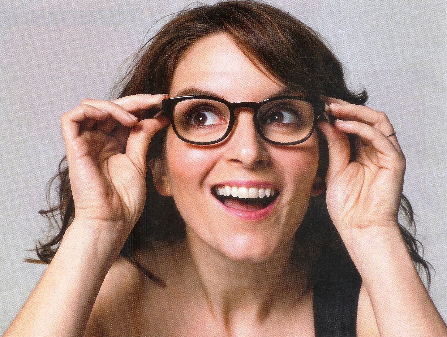 woman adjusting glasses