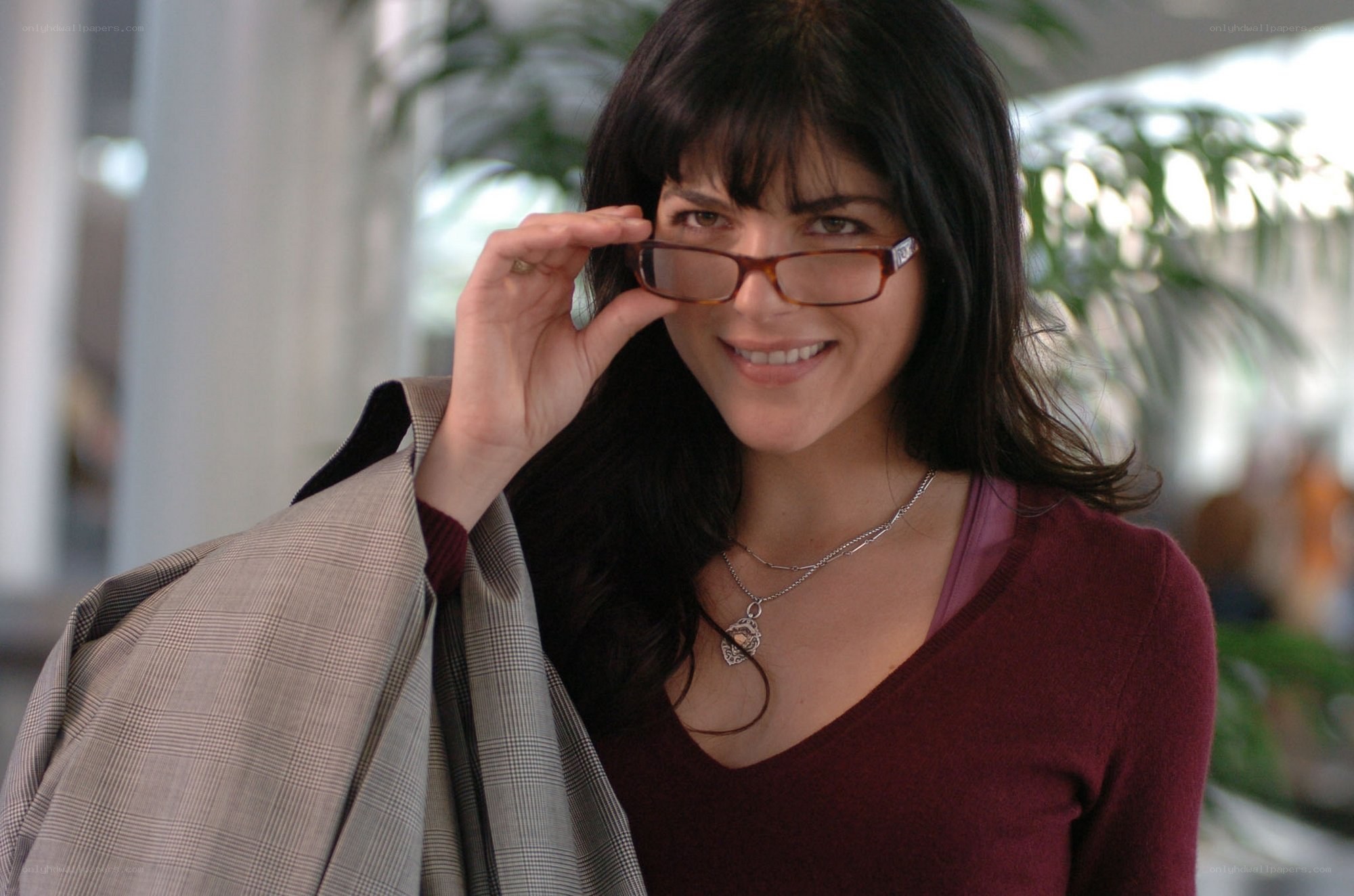 woman adjusting glasses